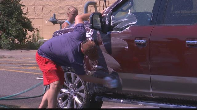 Image result for Suds, sports cars and selfies all part of a car wash for Alzheimer's